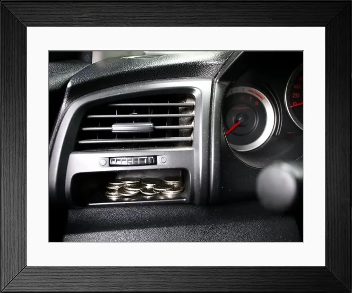 Framed Print : Photo of coins in a coin slot on a car's dashboard Framed Print : Photo of coins in a coin slot on a car's dashboard