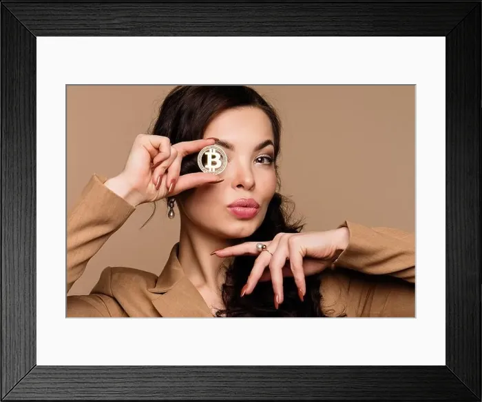 Framed Print : Cryptocurrency and blockchain. Girl shows btc coin holding in front of eye Framed Print : Cryptocurrency and blockchain. Girl shows btc coin holding in front of eye