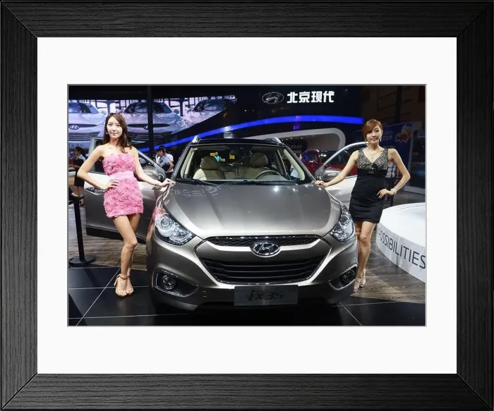 Framed Print : Models pose with a Hyundai ix35 during the 15th Chengdu Motor Show 2012 in Chengdu city Framed Print : Models pose with a Hyundai ix35 during the 15th Chengdu Motor Show 2012 in Chengdu city