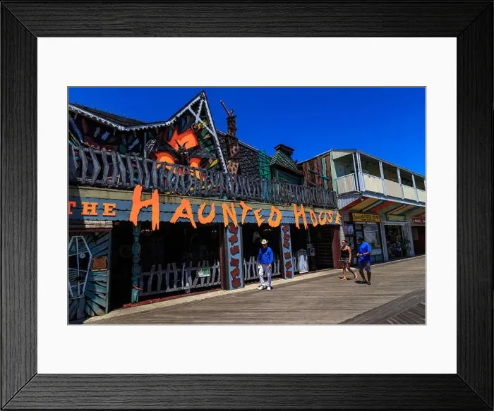 Framed Print : Ocean City, MD, USA - May 26, 2018: A Haunted House amusement located on the Ocean City boardwalk Framed Print : Ocean City, MD, USA - May 26, 2018: A Haunted House amusement located on the Ocean City boardwalk
