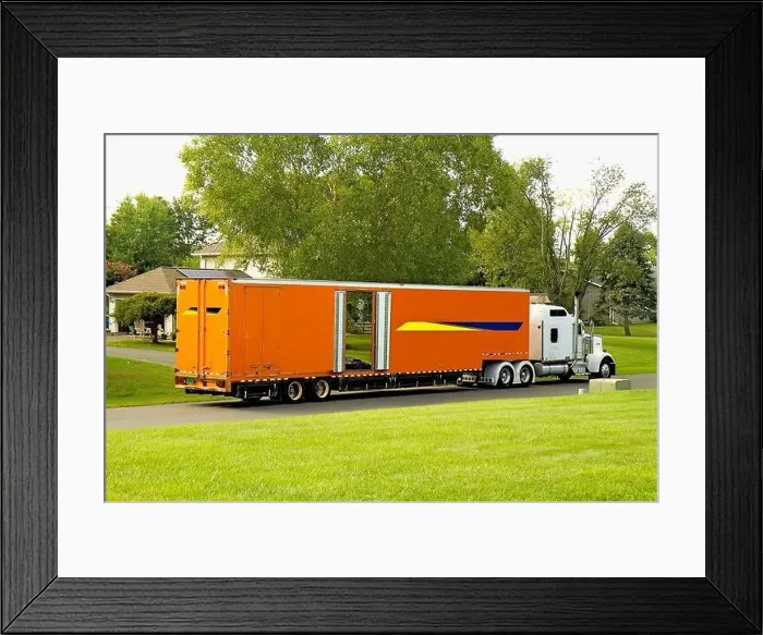 Framed Print : Large Orange Moving Truck out front of a neighborhood home while loading the owner's household item Framed Print : Large Orange Moving Truck out front of a neighborhood home while loading the owner's household item