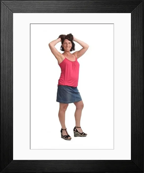 Framed Print : woman with denim skirt touching her hair on white background Framed Print : woman with denim skirt touching her hair on white background