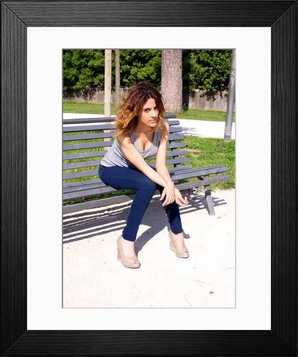 Framed Print : Young woman waiting angry on bench in a park Framed Print : Young woman waiting angry on bench in a park