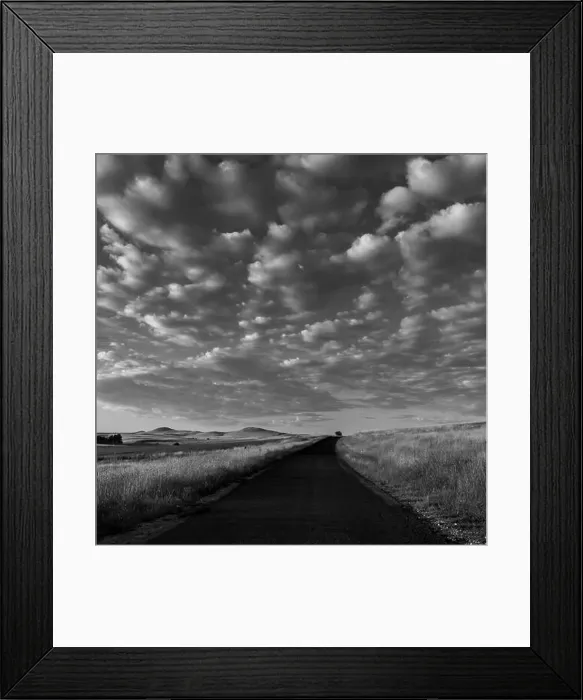 Framed Print : A grayscale of a sunrise over a road with cloudy sky in the background in Cooma, NSW, Australia Framed Print : A grayscale of a sunrise over a road with cloudy sky in the background in Cooma, NSW, Australia