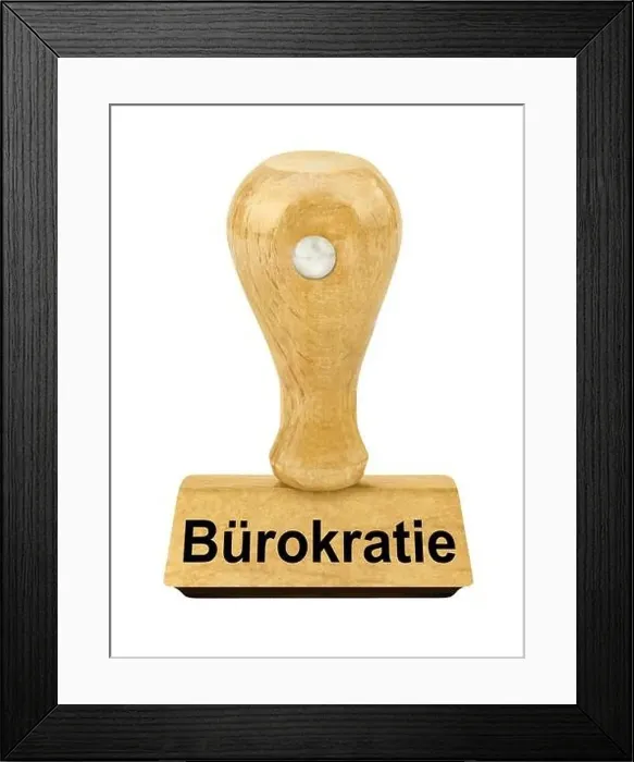 Framed Print : Wooden stamp and German Bureaucracy isolated against white background Framed Print : Wooden stamp and German Bureaucracy isolated against white background