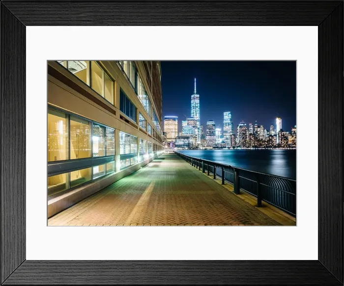 Framed Print : Waterfront walkway and view of the Lower Manhattan skyline at night, at Exchange Place in Jersey City, New Jersey Framed Print : Waterfront walkway and view of the Lower Manhattan skyline at night, at Exchange Place in Jersey City, New Jersey