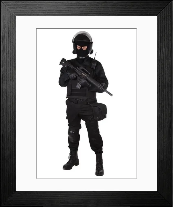 Framed Print : SWAT officer in black uniform isolated on white Framed Print : SWAT officer in black uniform isolated on white