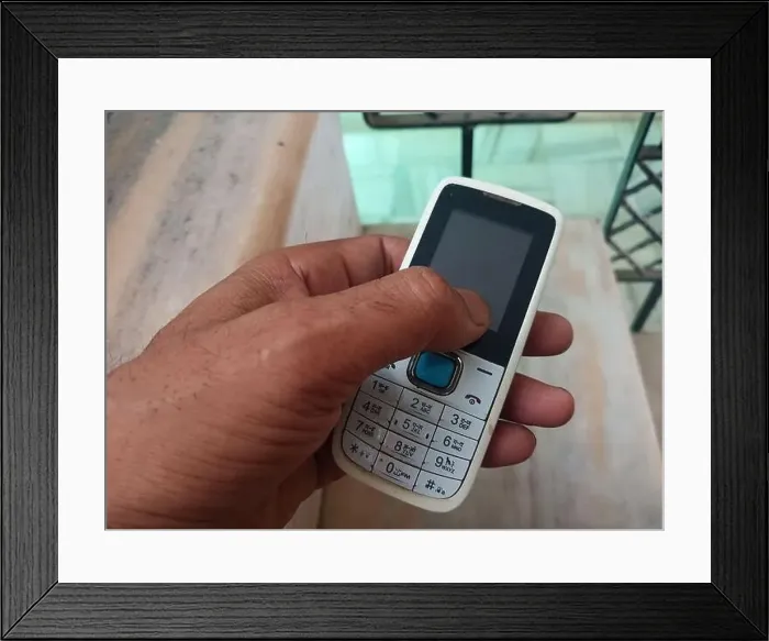 Framed Print : vintage keypad mobile phone in hand Framed Print : vintage keypad mobile phone in hand