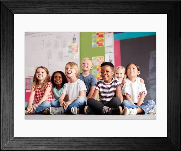 Framed Print : Group Of Elementary School Pupils Sitting On Floor In Classroom Framed Print : Group Of Elementary School Pupils Sitting On Floor In Classroom