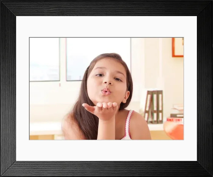 Framed Print : Portrait of smiling girl Blowing kisses Framed Print : Portrait of smiling girl Blowing kisses