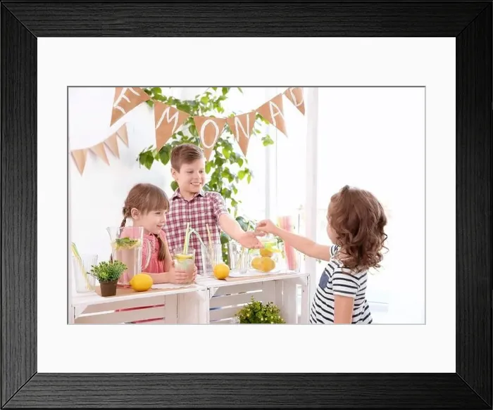Framed Print : Cute little kids selling lemonade at counter Framed Print : Cute little kids selling lemonade at counter
