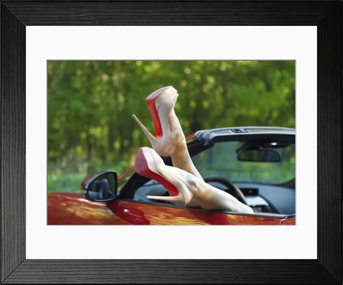 Framed Print : Woman legs in high heels out the windows in car above the green sunny background Framed Print : Woman legs in high heels out the windows in car above the green sunny background