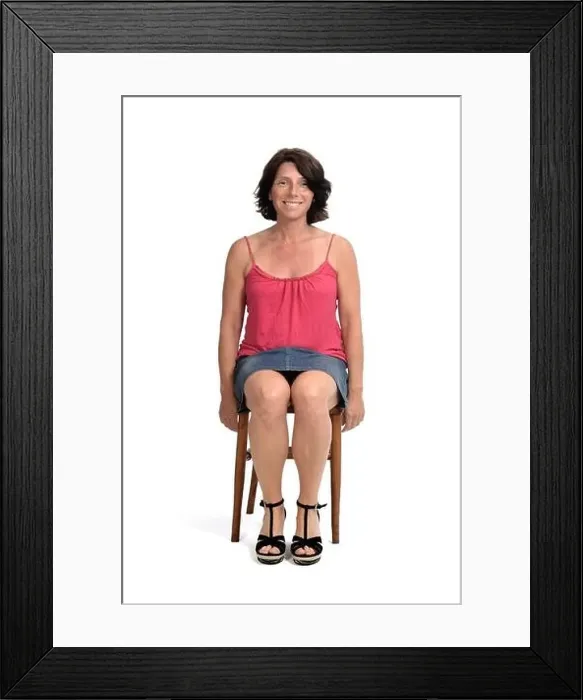 Framed Print : front view woman in skirt sitting on white background Framed Print : front view woman in skirt sitting on white background