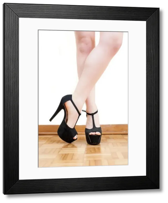 Framed Print : Young sexy woman feet with black high heels and legs, posing close up Framed Print : Young sexy woman feet with black high heels and legs, posing close up