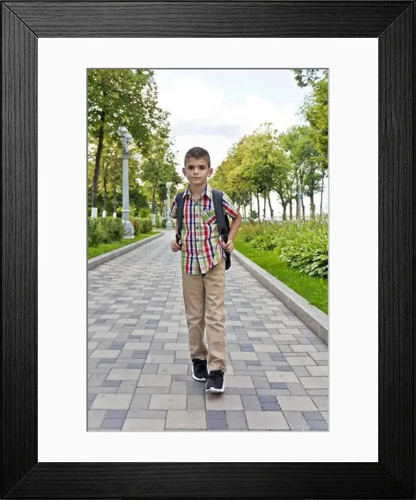 Framed Print : Cute brunette boy eleven years old walking in summer