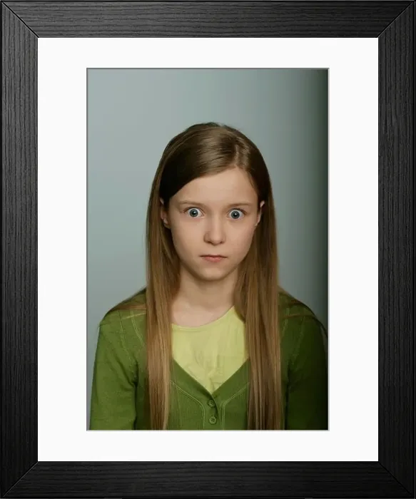 Framed Print : Scared girl looking at camera Framed Print : Scared girl looking at camera