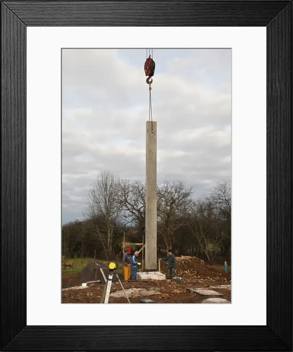 Framed Print : House building, installation of a concrete post on a concrete footing for a house's foundations Framed Print : House building, installation of a concrete post on a concrete footing for a house's foundations