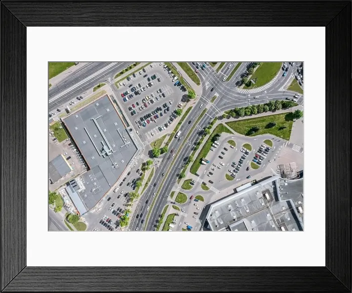 Framed Print : urban life. shopping center with parking lots and car traffic on city streets. aerial top view with drone