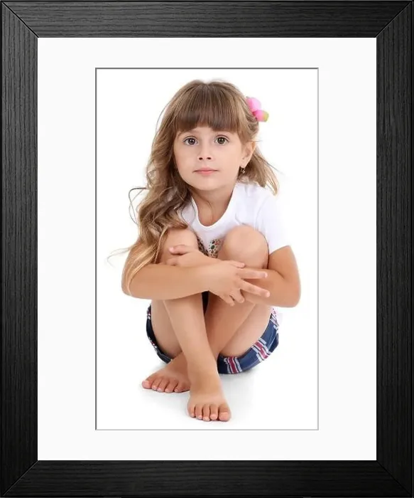 Framed Print : Little girl sitting on floor isolated on white Framed Print : Little girl sitting on floor isolated on white