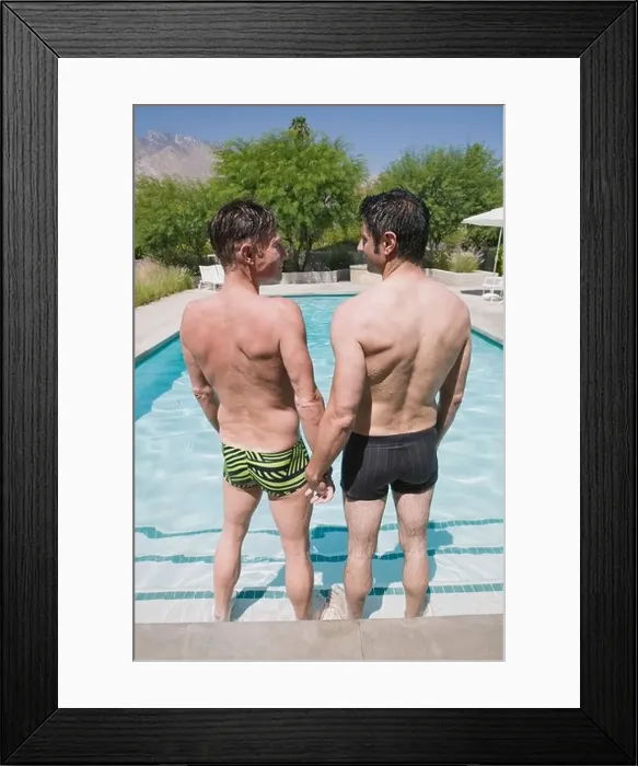 Framed Print : Gay couple standing in swimming pool Framed Print : Gay couple standing in swimming pool