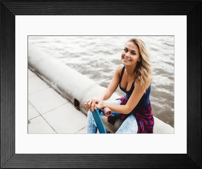 Framed Print : beautiful blonde woman posing with a skateboard in a city park Framed Print : beautiful blonde woman posing with a skateboard in a city park