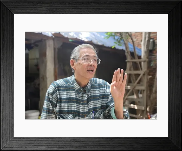 Framed Print : 70-year-old Japanese man Koji Shimada is pictured in the yard of his Japanese-style curry restaurant in Wuhan city Framed Print : 70-year-old Japanese man Koji Shimada is pictured in the yard of his Japanese-style curry restaurant in Wuhan city