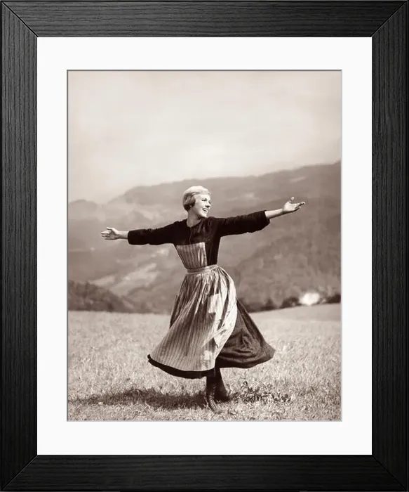 Framed Print : Julie Andrews twirling and singing on a mountaintop meadow in the 1965 Academy Award winning movie, The Sound of Music Framed Print : Julie Andrews twirling and singing on a mountaintop meadow in the 1965 Academy Award winning movie, The Sound of Music