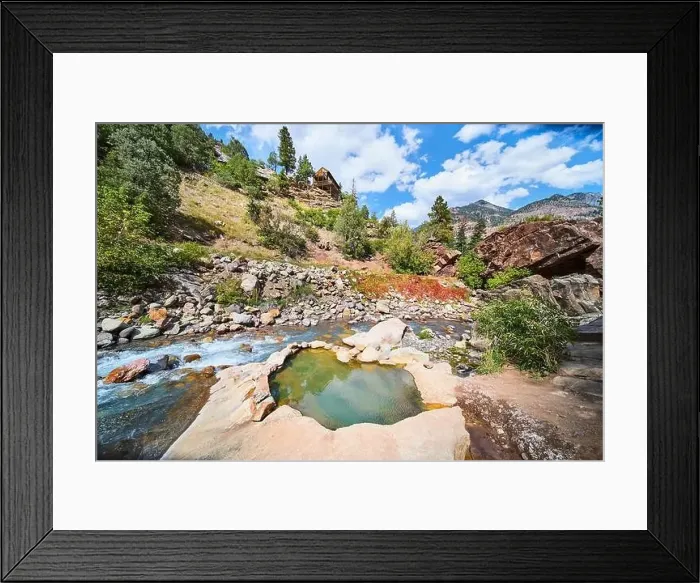 Framed Print : Hidden secret hot spring along river of mountains with log cabin overlooking Framed Print : Hidden secret hot spring along river of mountains with log cabin overlooking