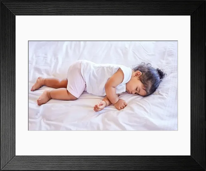 Framed Print : Little baby girl sleeping on her bed Framed Print : Little baby girl sleeping on her bed