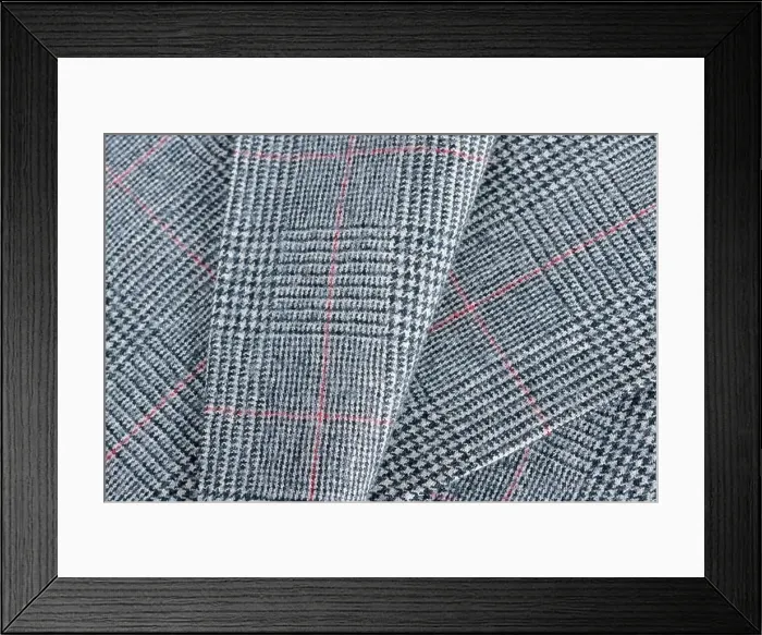 Framed Print : Glen plaid or Glenurquhart check a woolen fabric with a woven twill design of small and large checks used in suits Framed Print : Glen plaid or Glenurquhart check a woolen fabric with a woven twill design of small and large checks used in suits