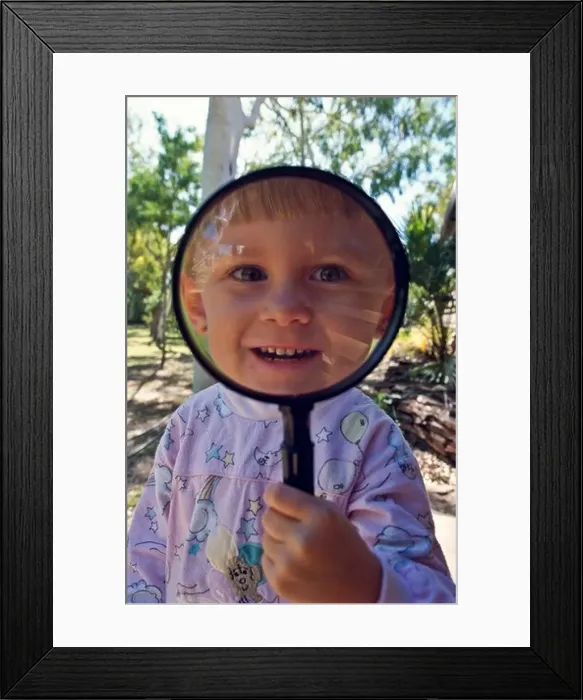 Framed Print : Young girl with magnifying ^glass Framed Print : Young girl with magnifying ^glass