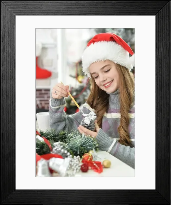 Framed Print : Cute long-haired girl preparing for Christmas at home Framed Print : Cute long-haired girl preparing for Christmas at home
