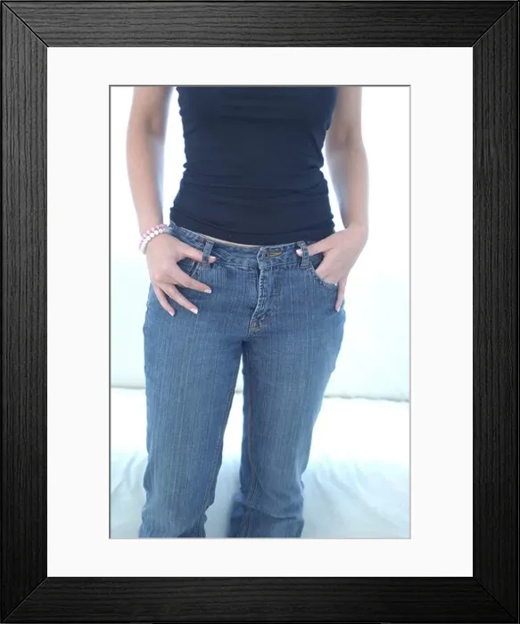 Framed Print : Young woman with her hands in her pocket Framed Print : Young woman with her hands in her pocket