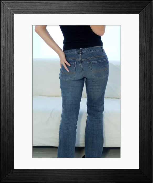 Framed Print : Young woman in front of a window Framed Print : Young woman in front of a window
