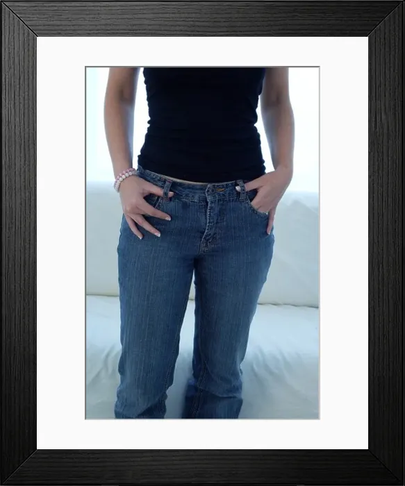 Framed Print : Young woman in front of a window, close up crop of her midsection Framed Print : Young woman in front of a window, close up crop of her midsection