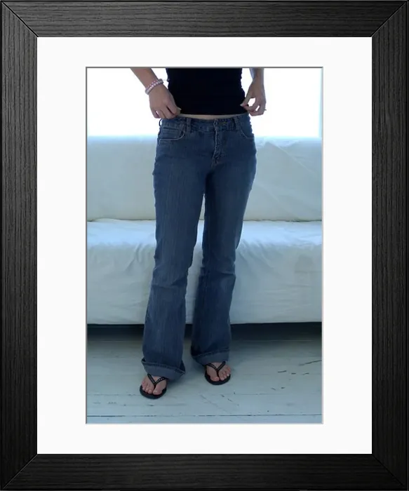 Framed Print : Young woman in jeans midsection Framed Print : Young woman in jeans midsection