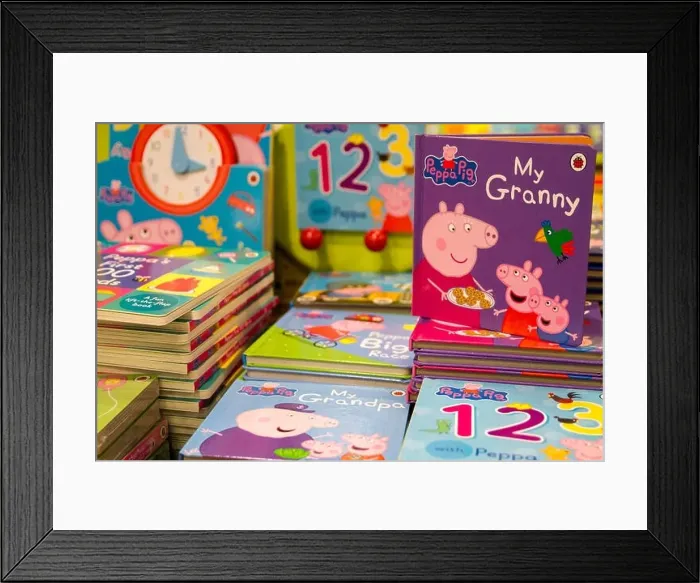 Framed Print : Childrens books, kids books, kid, child Peppa Pig books on Display in a bookshop, London UK childhood, education concept Framed Print : Childrens books, kids books, kid, child Peppa Pig books on Display in a bookshop, London UK childhood, education concept
