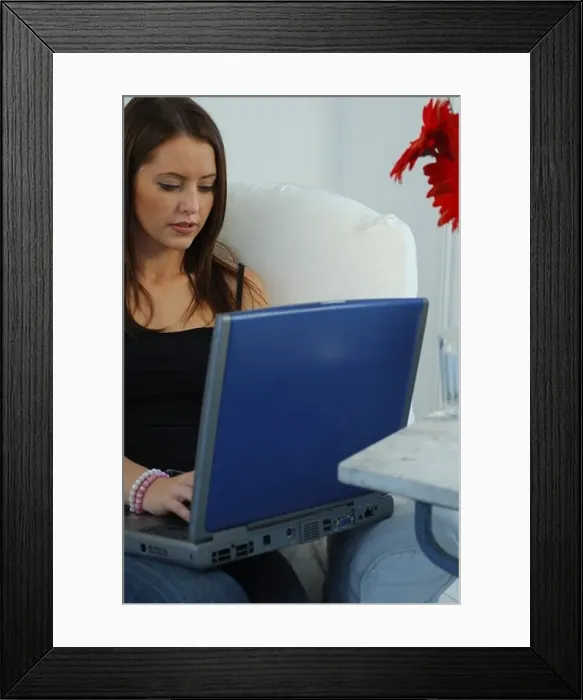 Framed Print : Young woman on a laptop Framed Print : Young woman on a laptop