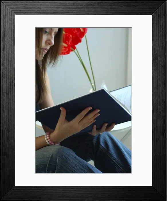 Framed Print : Young Woman Reading a book Framed Print : Young Woman Reading a book