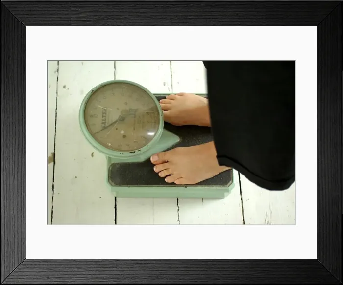 Framed Print : Old Fashioned Weighing scales and feet Framed Print : Old Fashioned Weighing scales and feet