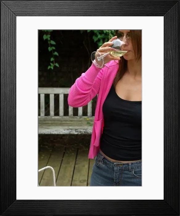 Framed Print : Young Woman in Garden drinking wine Framed Print : Young Woman in Garden drinking wine
