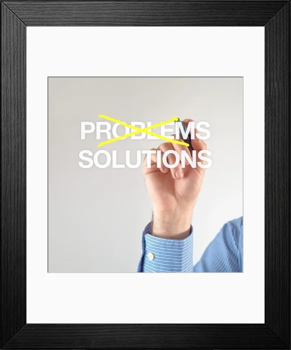 Framed Print : Solutions, not problems. Businessman crosses out problems for solutions with yellow marker pen on the screen Framed Print : Solutions, not problems. Businessman crosses out problems for solutions with yellow marker pen on the screen