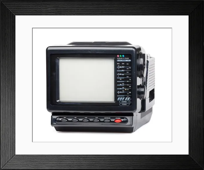 Framed Print : Vintage small portable color TV set with radio on white background Framed Print : Vintage small portable color TV set with radio on white background