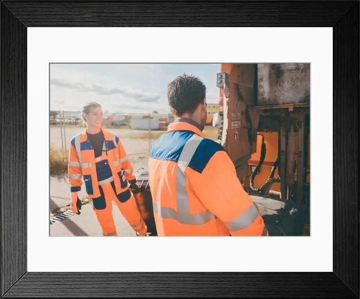 Framed Print : Garbage man and women cleaning dustbins into waste truck Framed Print : Garbage man and women cleaning dustbins into waste truck