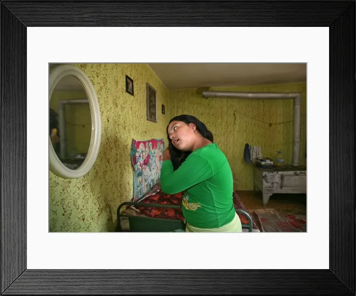 Framed Print : Elisaveta doing her hair in front of the mirror