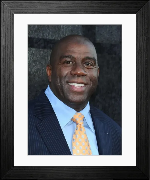 Framed Print : Magic Johnson arrives at the Time Warner cable sports TV channel launch in El Segundo, CA. 1st Oct 2012. USA