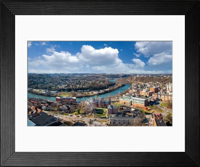 Framed Print : Aerial drone panoramic shot of the downtown campus of WVU in Morgantown West Virginia showing the river in the distance Framed Print : Aerial drone panoramic shot of the downtown campus of WVU in Morgantown West Virginia showing the river in the distance