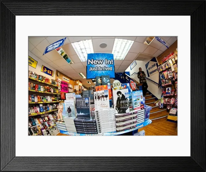 Framed Print : A stack of discount cheap hardback books on sale at a branch of The Works, UK Framed Print : A stack of discount cheap hardback books on sale at a branch of The Works, UK