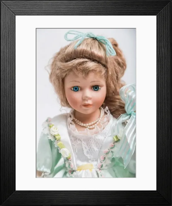 Framed Print : Portrait of a ceramic porcelain handmade vintage doll with long blond hair Framed Print : Portrait of a ceramic porcelain handmade vintage doll with long blond hair
