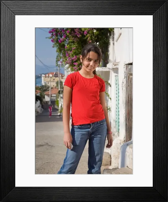 Framed Print : A Turkish young girl smiling in a street in Fethiye Turkey Framed Print : A Turkish young girl smiling in a street in Fethiye Turkey